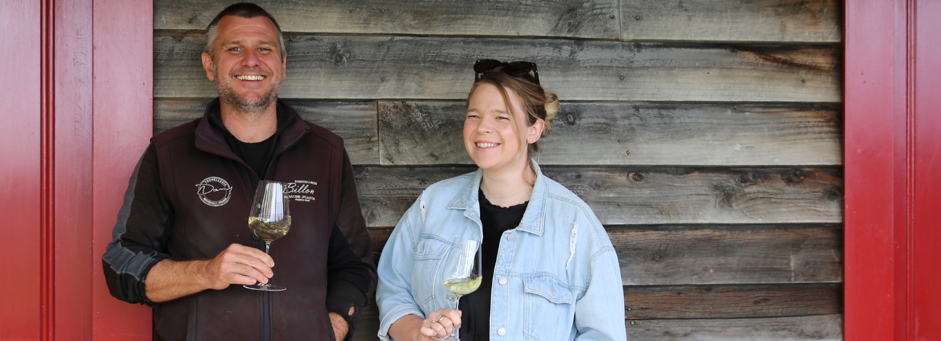 A man and woman enjoying Neudorf wines 